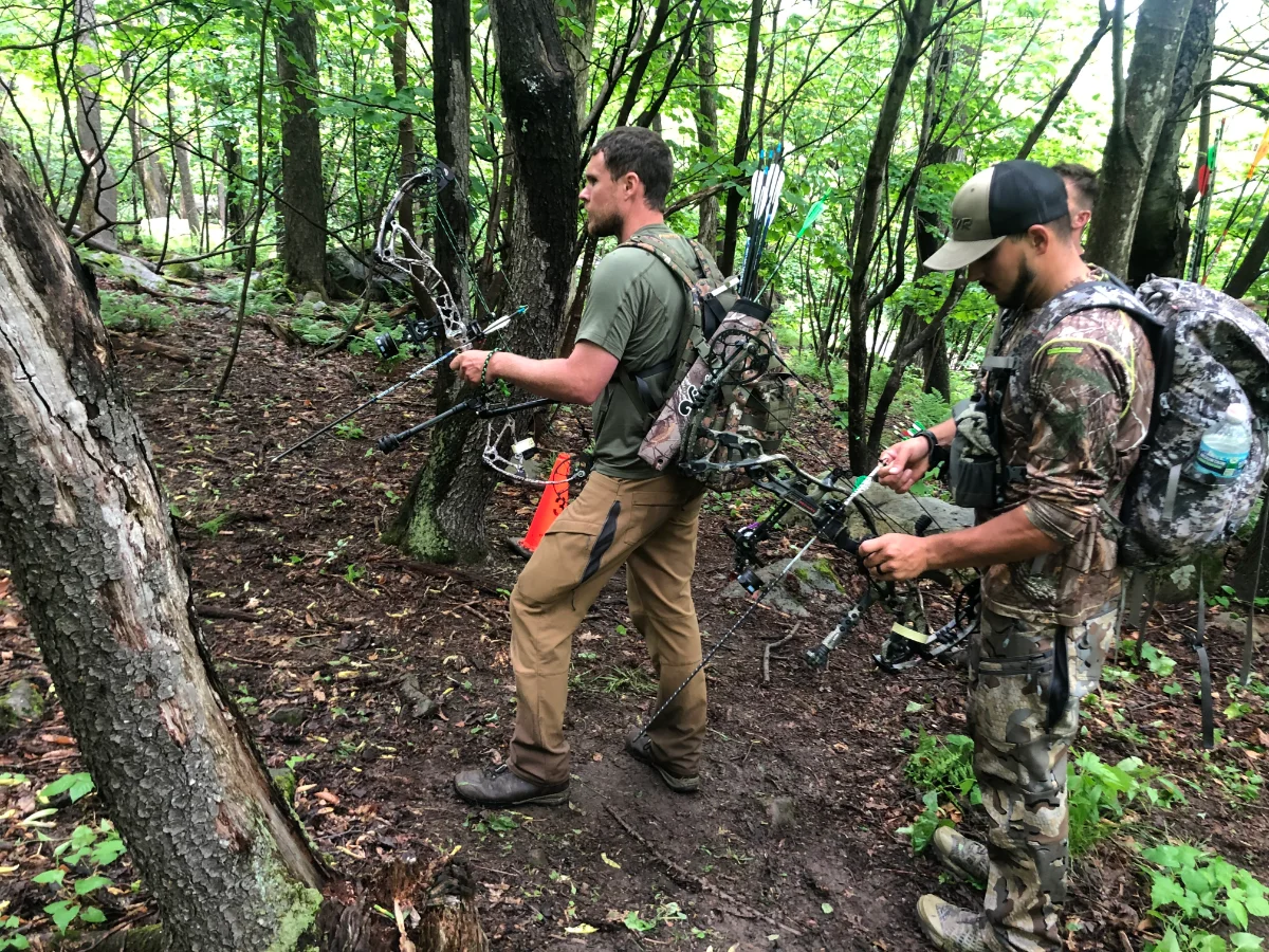 Shooters walking the wooded course